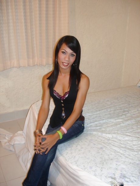 Solo brunette ladyboy Amy removing jeans to expose nice ass and small tits