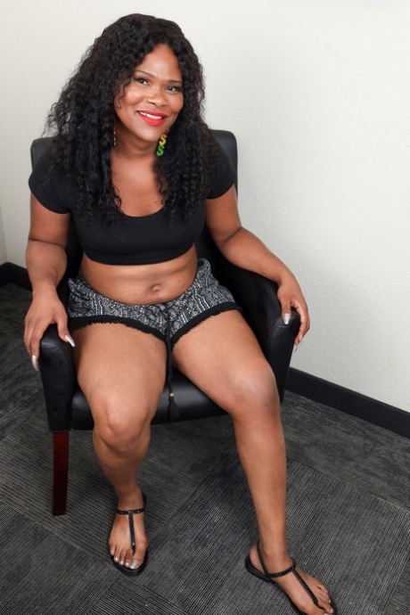 Chubby ebony shemale Gemini unveils her big ass and licks her saggy tits