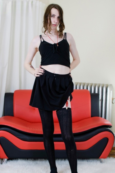 Skinny brunette shemale Allison Morgan strips to her stockings & masturbates