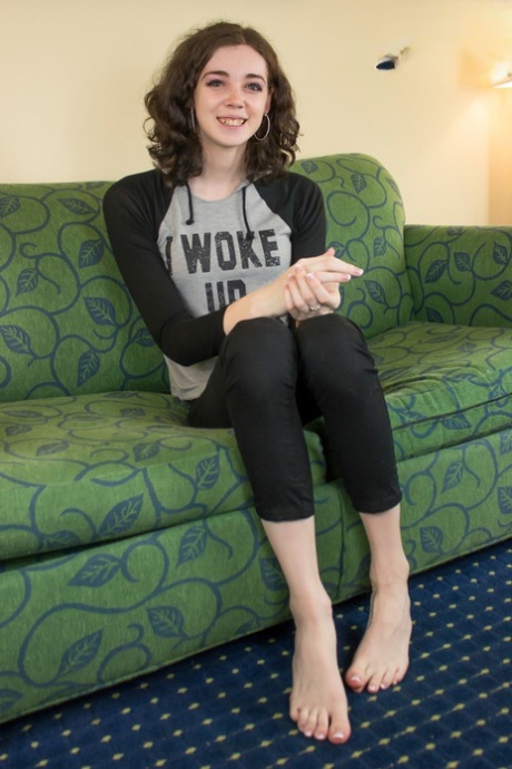 Dark-haired shemale Sasha Skyes displaying her sensitive feet, cock & booty