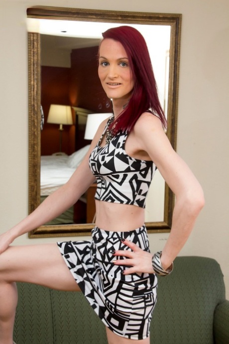 Skinny redheaded tranny Brooke Zanell flaunts her tits and fat dick