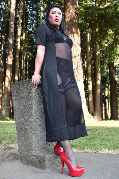 Naughty shemale teases in see-through dresses & high heels outdoors