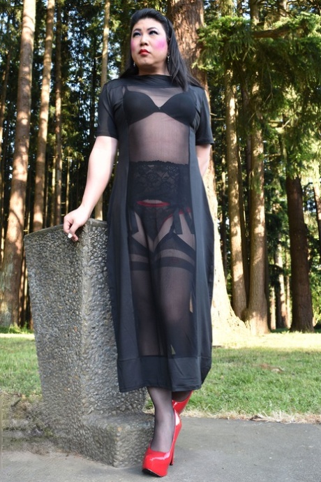 Naughty shemale teases in see-through dresses & high heels outdoors