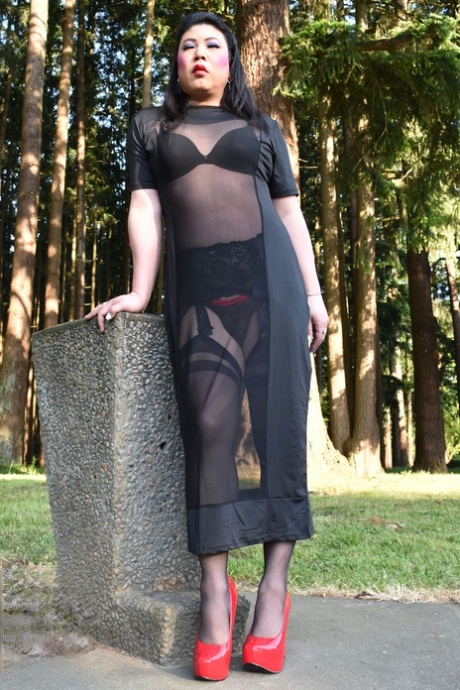 Naughty shemale teases in see-through dresses & high heels outdoors