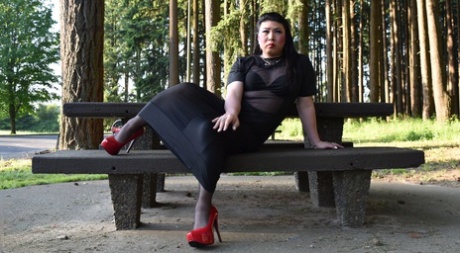 Naughty shemale teases in see-through dresses & high heels outdoors