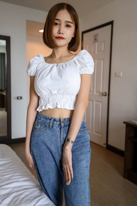 Pretty Asian shemale teases in black panties after giving a POV blowjob