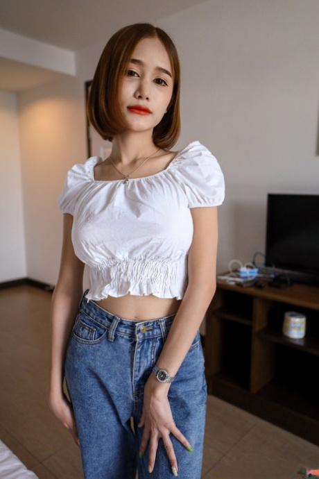 Pretty Asian shemale teases in black panties after giving a POV blowjob