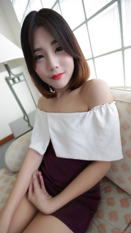 Brunette Asian shemale exposes her tiny tits and poses in undies