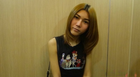 Shy Asian ladyboy May posing dressed up and butt naked in a solo