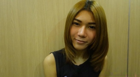 Shy Asian ladyboy May posing dressed up and butt naked in a solo