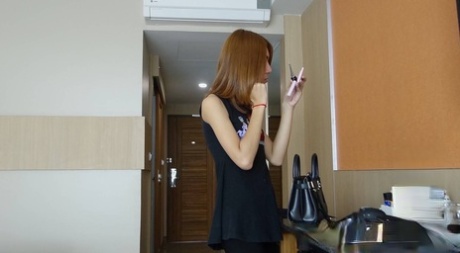 Shy Asian ladyboy May posing dressed up and butt naked in a solo