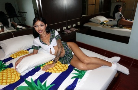 Skinny shemale Itim shows off her small booty & her tight anal love hole