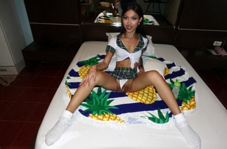 Skinny shemale Itim shows off her small booty & her tight anal love hole