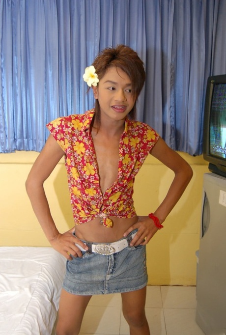 Petite Asian shemale Ment undresses to show her unaroused small dick